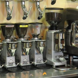 A row of different coffee grinders