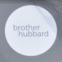 The Brother Hubbard logo: 'brother hubbard' in a large, white circle.