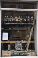 The window Edinburgh's Machina Espresso, showing off some of the wares, including cups, grinders and espresso machines.