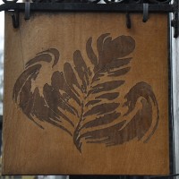 The trademark Papercup leaf from the sign hanging outside.