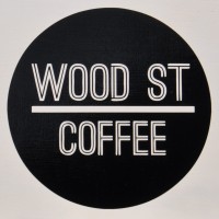 Wood Street Coffee logo, white writing on a black circle, "Wood St" above the line, "Coffee below it.