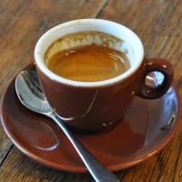 An espresso is a classic earthenware Inker cup from Café Lomi