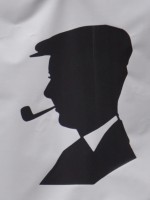 The logo of the Milkman, on Edinburgh's Cockburn Street, a silhouette o the owner's grandfather, seen side-on, wearing a flat cap and smoking a pipe. It was taken from a photograph taken in 1938 at the Empire Exhibition in Glasgow.