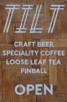 The Tilt A-board, proudly displaying Tilt's credentials: craft beer, speciality coffee, loose-leaf tea and pinball. Naturally.