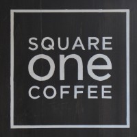 The words "SQUARE one COFFEE" one word per row, white on black inside a white square.