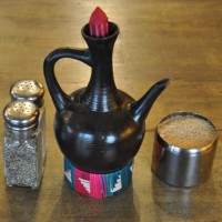 A miniature Jebena, the traditional Ethiopian coffee pot, on a table at Liverpool's Coffee & Fandisha