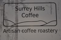 The Surrey Hills Coffee logo from the back wall of the coffee shop on Chapel Street, Guildford.