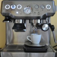 My Sage Barista Express in action, making an espresso with the Coffee Spot cup.