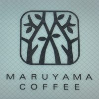 Detail from the sign above the door of Maruyama Coffee's branch in Nishi Azabu