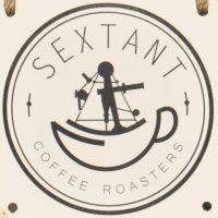 The Sextant Coffee Roasters logo from the sign outside the front of the store on Folsom Street.