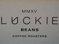 Detail from the front of the Luckie Beans coffee cart on the concourse of Glasgow's Queen Street Station.