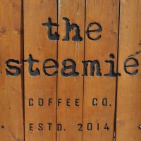 Detail from the A-board outside The Steamie on Glasgow's Argyle Street on a sunny day in May. Reads: "The Steamie Coffee Co. Estd. 2014"
