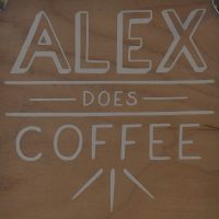Details from the sign hanging on the door of Alex Does Coffee