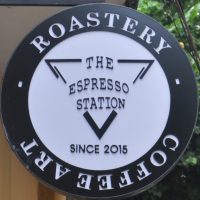 The Espresso Station logo, taken from a sign halfway down the alley which houses it in Hoi An.