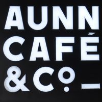 The sign hanging outside AUNN Cafe & Co. in Shanghai