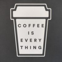 "Coffee is Everything", written inside the outline of a takeaway coffee cup: detail from a sign inside The Foundation Coffee House in Manchester's Northern Quarter.