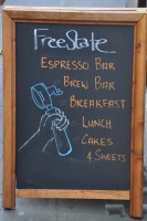 The A-board outside FreeState Coffee: Espresso Bar, Brew Bar, Breakfast, Lunch, Cakes & Sweets