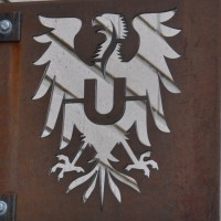 The Ultimo symbol, a Roman Eagle, here cut out of an iron plate.