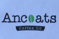 The Ancoats Coffee Co logo, the "o" in Ancoats being replaced with a stylised green coffee bean.