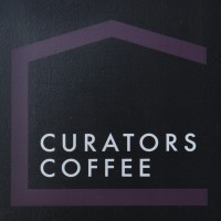 The Curators Coffee sign.