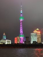 The futurist Oriental Pearl TV tower on the Pudong side of Huangpu River, as seen from the Bund at night.