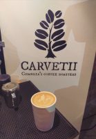 A flat white in my Therma Cup in front of the Carvetii logo at this year's Manchester Coffee Festival.