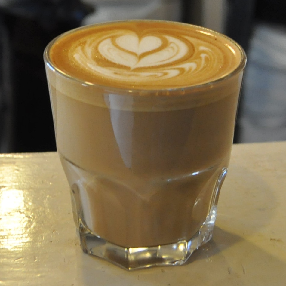My flat white, in a glass, at Balance in Brixton.