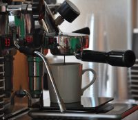 An espresso being pulled at Ritual Barbers in Madison using a bottomless portafilter.