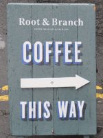 The Root & Branch sign, pointing the way to good coffee on Belfast's Jameson Street.