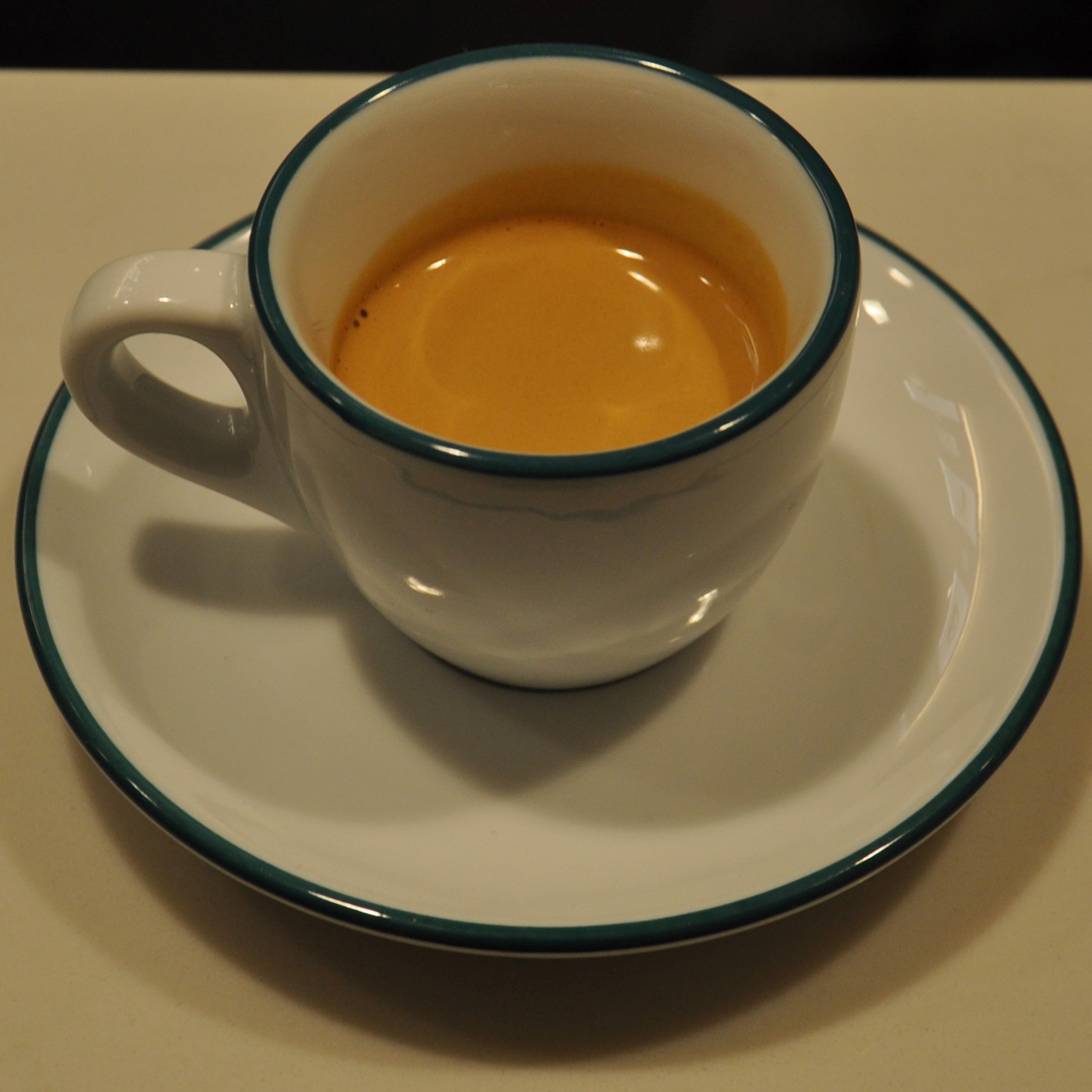 A lovely Verve espresso in a classic white cup, pulled at Infuse Coffee & Tea Bar in River North Point, Chicago.