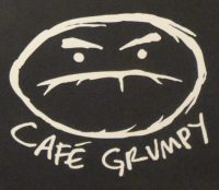 The Cafe Grumpy logo from the bottom of the menu on the wall of the Nolita branch.