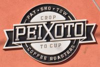 The Peixoto logo from the wall outside, both esposing the crop to cup philosophy and explaining how to pronouce the name: "Pay - Sho - Tow".
