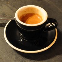 An Indonesian single-origin espresso in a classic black cup, served at 200 Degrees in Leeds.