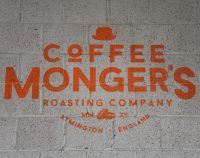The Coffee Monger's Roasting Company's logo from the wall of the roastery in Lymington, Hampshire.