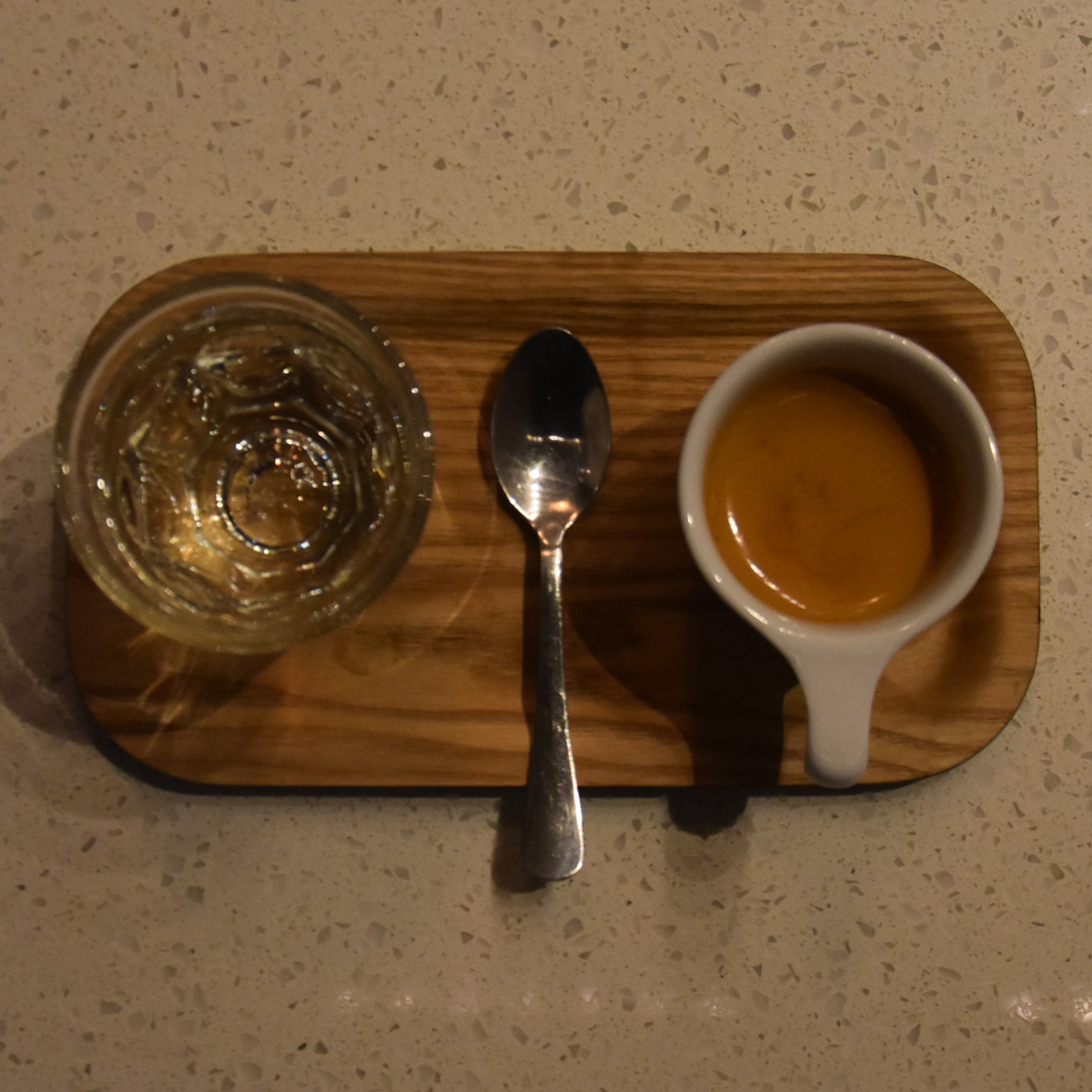 My espresso, made with the 120PSI house-blend at Presta Coffee, Mercado San Augustin, and beautifully presented on a wooden tray with a glass of sparkling water.