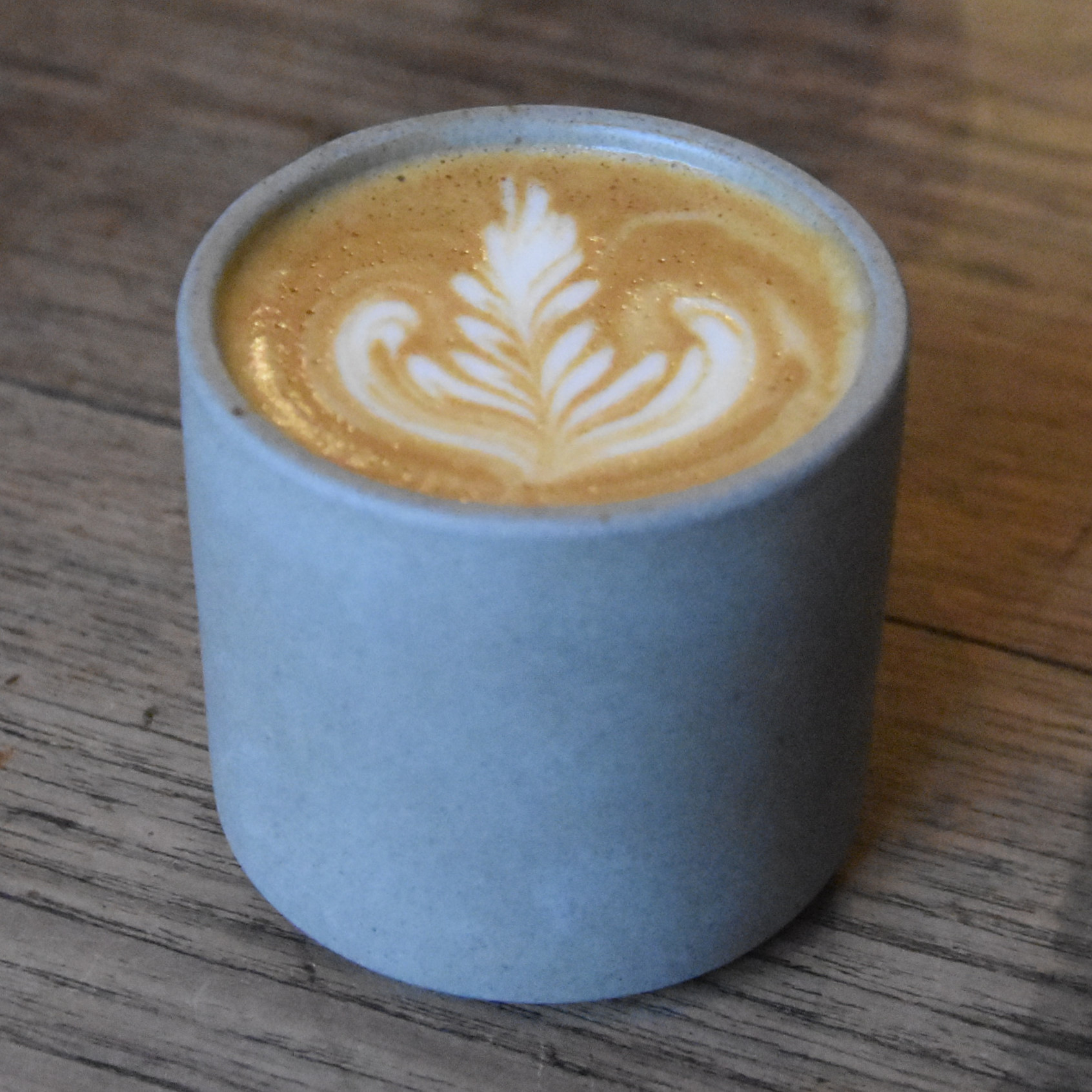 A lovely flat white, made with a Colombian single-origin from The Good Coffee Cartel, and served in handless ceramic cup at Glasgow's East Coffee Company.