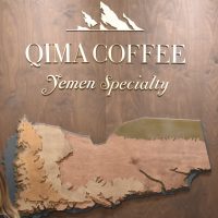 Detail from the stand of Qima Coffee, including a wooden relief map of Yemen, taken from the stand at the 2019 London Coffee Festival.