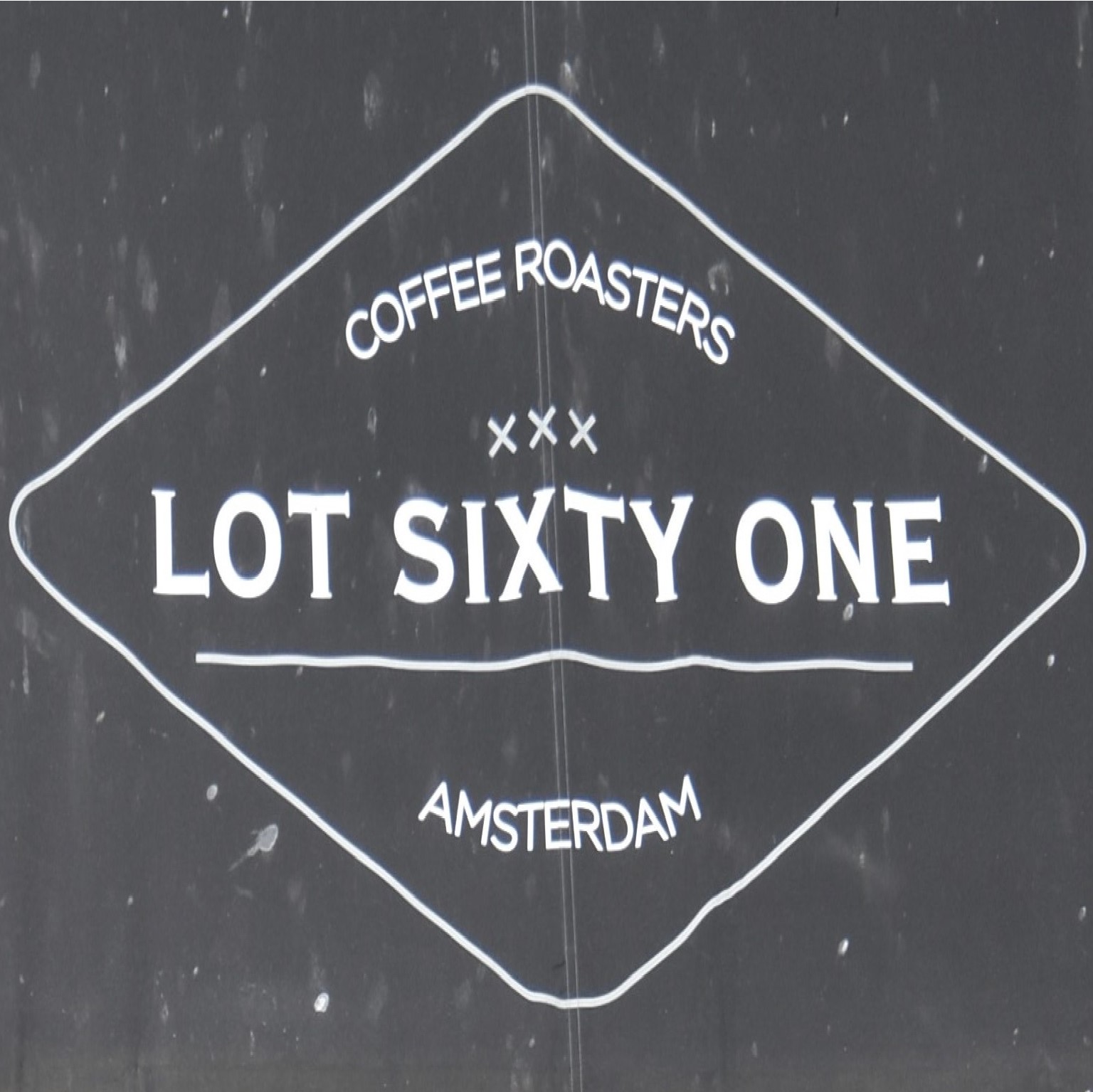The Lot Sixty One Coffee Roasters logo from the awning outside the coffee shop on Kinkerstraat, west Amsterdam.