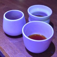 Three different types of cup: open (front), tulip (back left) and split (back right) at the La Cimbali Sensory Session at the 2019 London Coffee Festival. What impact do they have on your perception of taste?