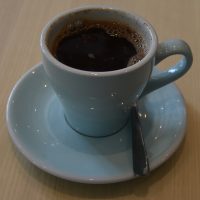 A Kopi Tubruk, a traditional Indonesian coffee, where hot water is poured directly on ground coffee, stirred and then left to stand, made with a naturally-processed Kerinci Kayu Aro from Ngopi in Birmingham.