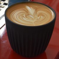 A flat white, made with the The Roasting Party's Elixir 22 blend and served in my Huskee Cup at Out of the Box in Tonbridge.