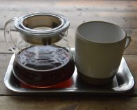 A lovely Kenyan Githaka AB Estate V60, roasted and served at Ozone in Shoreditch, the coffee presented on a tray, with a short mug next to the carafe.