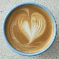 The latte art in my Therma Cup at % Arabica, Arashiyama.