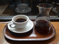 A V60 of the Galapagos San Cristolbol at HR Higgins, beautifully presented in a carafe, cup on one side, resting on the window-bar in the basement coffee room.