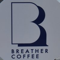 The Breather Coffee logo from the curbside sign outside the shop in Zushi, Kanagawa prefecture, Japan.