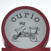 Details of the sign from outside Curio Espresso and Vintage Design in Kanazawa.
