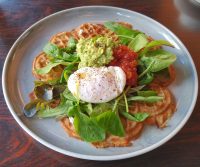 A Norwegian waffle, which I had for breakfast at Fuglen Asakusa, topped with a poached egg, spinach, salsa and avocado.