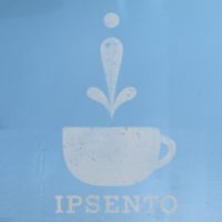 The Ipsento logo from the back wall of the coffee shop's front room on Western Avenue in Chicago.