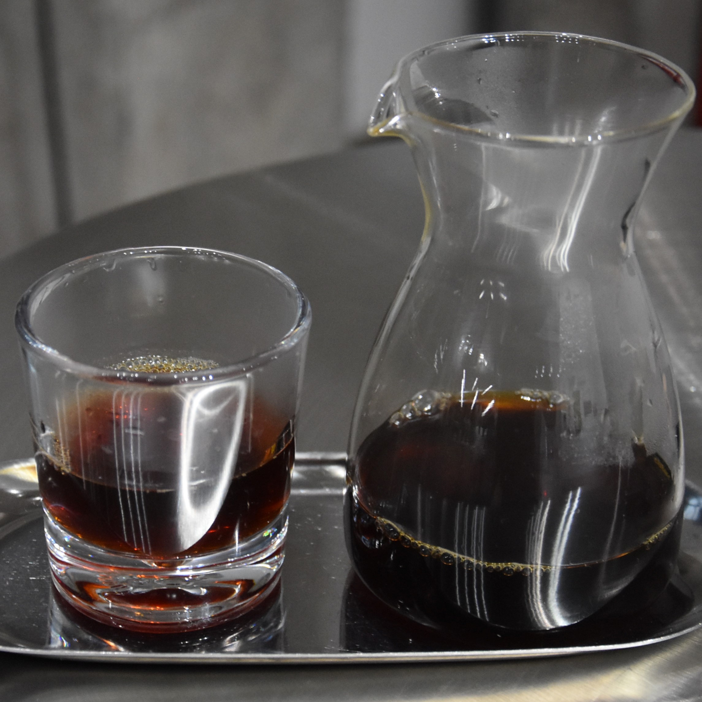 A naturally-processed Yunnan single-origin served in a carafe, with a glass on the side, at UNDEF/NE in Shanghai.