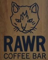The sign hanging outside RAWR Coffee Bar, part of Cat Town in Oakland, California.